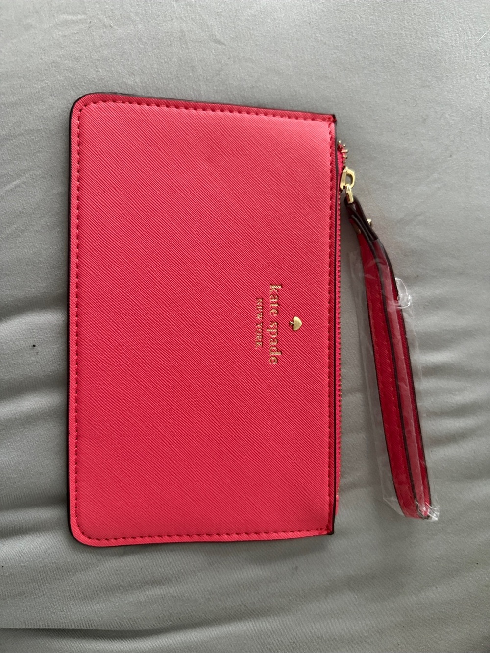 kate spade Bright Pink Saffiano Wristlet with Gold Logo